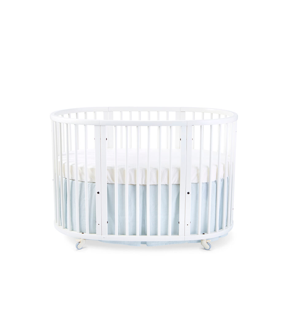 Stokke® Sleepi™ Bed, White. Bed Skirt Mist. US only.